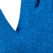 A close up of a large blue Cordova rubber glove with a white background.