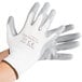 A pair of large white Cordova gloves with gray nitrile coating on the palms.