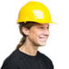 A woman wearing a Cordova yellow hard hat.