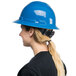 A woman wearing a blue hard hat.