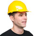 A man wearing a yellow Cordova hard hat.