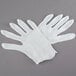 A pair of white Cordova inspection gloves.