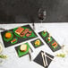 An Acopa black slate tray on a table with a variety of food items.