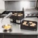 A Weston food dehydrator tray with food on a counter.