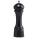 A black pepper mill with a silver top.