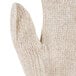 A beige knitted Cordova jersey glove with a thumb.