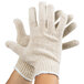 A pair of Cordova natural polyester and cotton work gloves with a white knit.