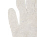 A close up of a Cordova work glove with a blue thumb.