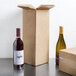 A bottle of wine next to a Polar Tech wine shipper box.