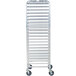 A white metal Regency steam table pan rack with wheels.