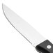 A Walco stainless steel steak knife with a black Delrin handle.