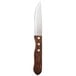 A Walco stainless steel steak knife with a stained hardwood handle.