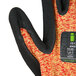 A pair of Cordova heavy duty work gloves with a black and orange design.