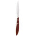 A Walco stainless steel steak knife with a Pakka wood handle.