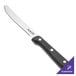 A Walco stainless steel steak knife with a black Delrin handle.