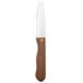 A Walco stainless steel steak knife with a stained hardwood handle.