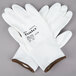 A pair of Cordova white gloves with white polyurethane palm coating.