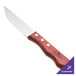 A Walco steak knife with a wooden handle.
