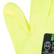 A close up of a pair of Cordova yellow and white cut resistant gloves with a yellow palm.