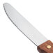 A Walco stainless steel steak knife with a jumbo hardwood handle.