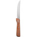 A Walco stainless steel steak knife with a brown Pakka wood handle.