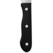 A close-up of a Walco stainless steel steak knife with a black Delrin handle.