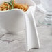 A Villeroy & Boch white porcelain bowl with noodles and a sprig of rosemary.