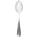 A Walco stainless steel serving spoon with a white background.