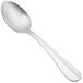 A close-up of a Walco stainless steel serving spoon with a silver handle.