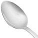 A Walco Lancer stainless steel serving spoon with a silver handle.