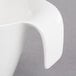 A Villeroy & Boch white porcelain cup with a handle.