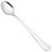 A close-up of a Walco stainless steel spoon with a silver handle.