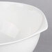 A close-up of a white Villeroy & Boch salad bowl.