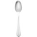 A Walco stainless steel dessert spoon with a silver handle.