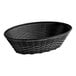 A black Carlisle oval plastic serving basket with a handle.