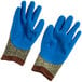 A pair of blue and brown Cordova Power-Cor Max cut resistant gloves with blue latex palms.