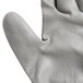 A close-up of a Cordova white HPPE glove with a gray palm.