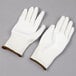 A pair of large Cordova Monarch white engineered fiber work gloves with white polyurethane palm coating.