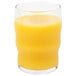 A Libbey Governor Clinton beverage glass filled with orange juice on a white background.