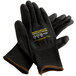 A pair of extra large black Cordova Monarch work gloves with black polyurethane palms and a yellow logo.