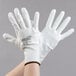 A pair of Cordova Mirage white gloves with white polyurethane palm coating.