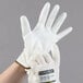 A pair of Cordova Monarch white gloves with white polyurethane palm coating.