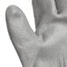 A pair of Cordova gray gloves with a gray palm coating.