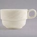 A white Homer Laughlin china tea cup with a handle.