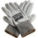 A pair of Cordova Monarch gray and black gloves with gray polyurethane palms on a white background.