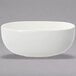 A white bowl on a table.