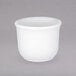 A Villeroy & Boch white porcelain egg cup with lid.