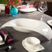 A table with a white Villeroy & Boch Urban Nature fruit bowl and plates on it.