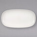 A white Villeroy & Boch oval platter on a gray surface.