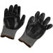 A pair of black Cordova Monarch work gloves with gray stripes.